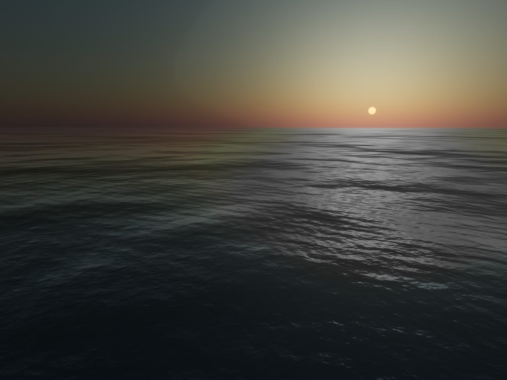 A wide ocean surface at sunset, low waves reflecting an orange sky and a low sun near the horizon.