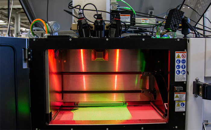 The Phase3D structured-light system mounted on the machine, with camera and projector visible.